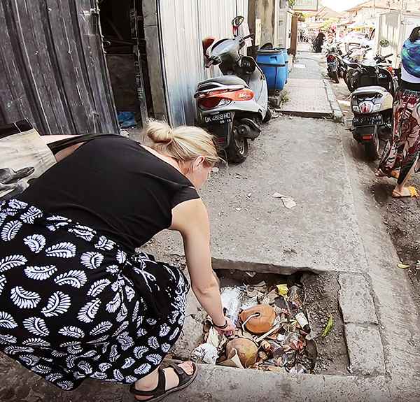 Picking up litter in the streets of Bali to experiment with making a collage out of litter